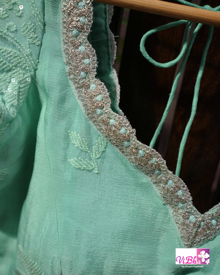 Mint Green Designer Saree with Tonal Floral Embroidery and Tassel Details