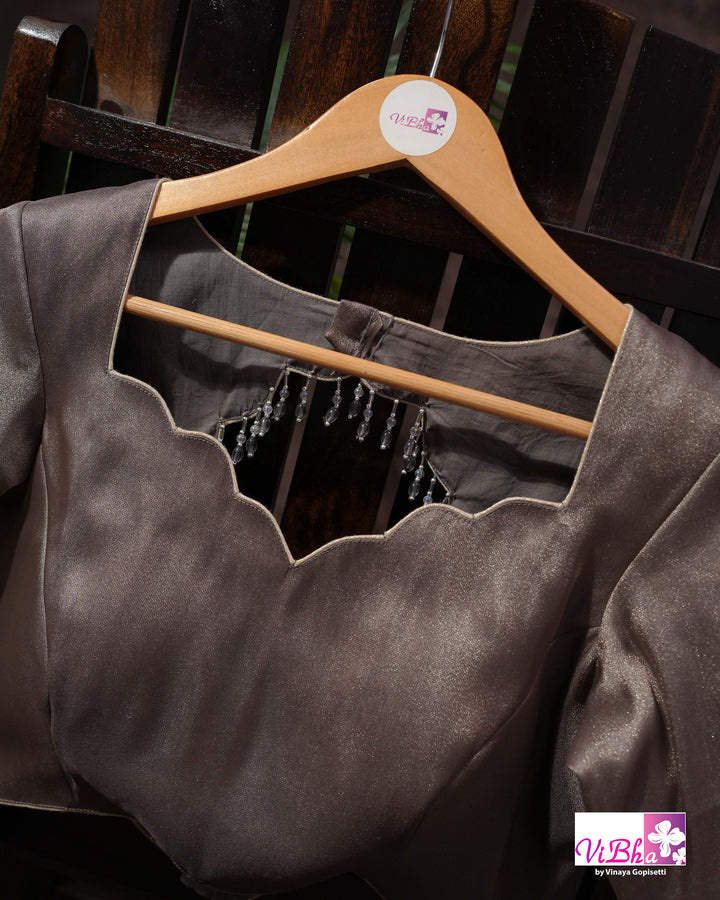 Taupe Shimmer Designer Saree with Ornamental Motifs and Scalloped Border