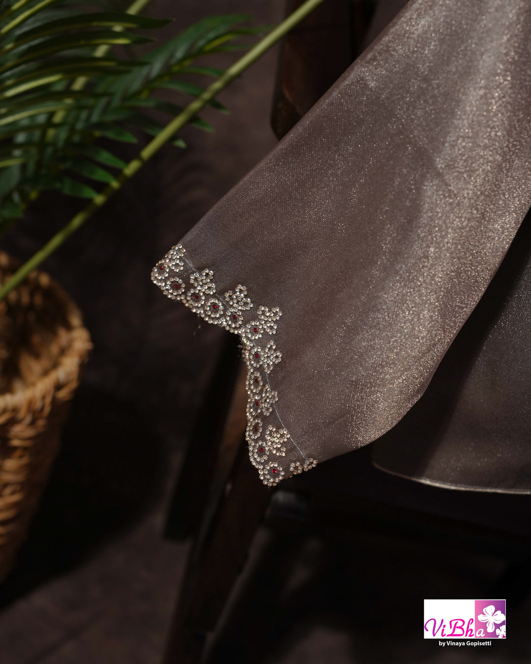 Taupe Shimmer Designer Saree with Ornamental Motifs and Scalloped Border