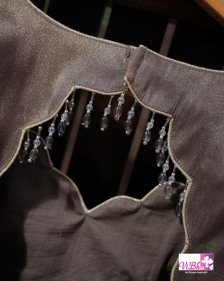 Taupe Shimmer Designer Saree with Ornamental Motifs and Scalloped Border