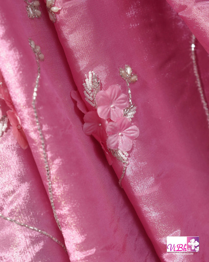 Pink Shimmer Designer Saree with Floral Detailing and Fuchsia Blouse Styling