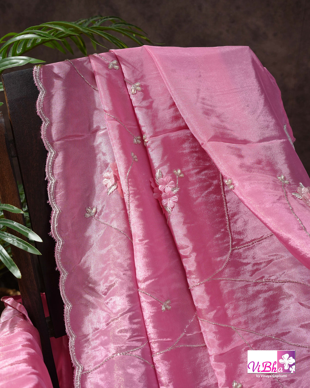 Pink Shimmer Designer Saree with Floral Detailing and Fuchsia Blouse Styling