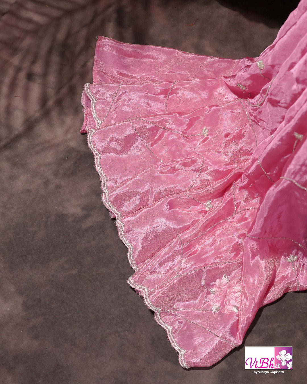 Pink Shimmer Designer Saree with Floral Detailing and Fuchsia Blouse Styling