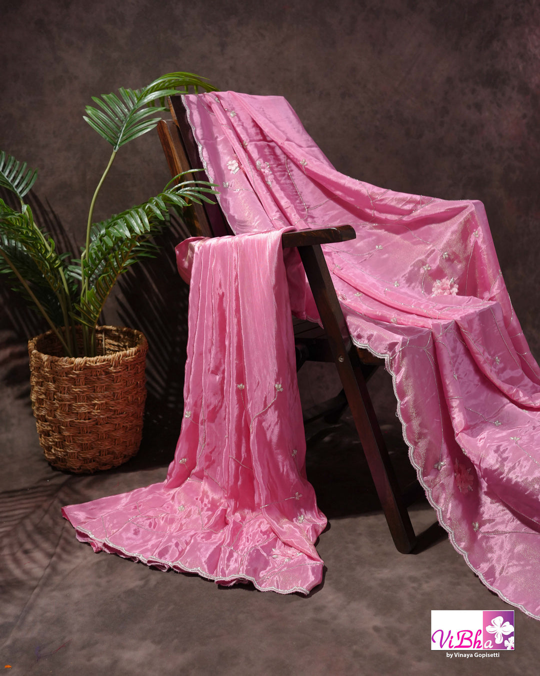 Pink Shimmer Designer Saree with Floral Detailing and Fuchsia Blouse Styling