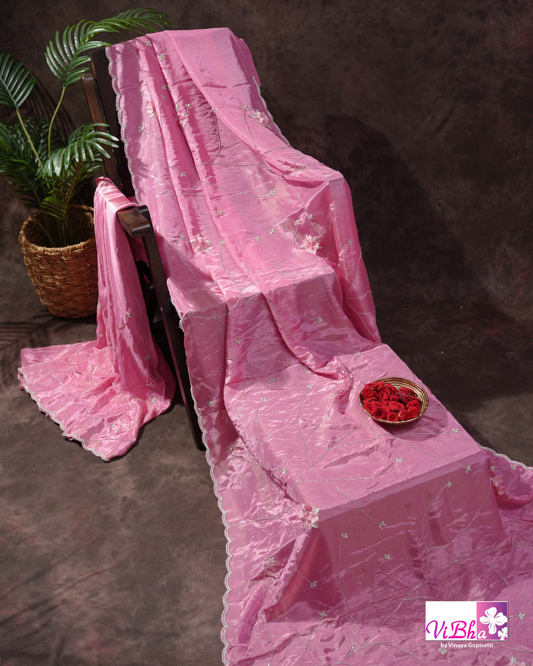 Pink Shimmer Designer Saree with Floral Detailing and Fuchsia Blouse Styling