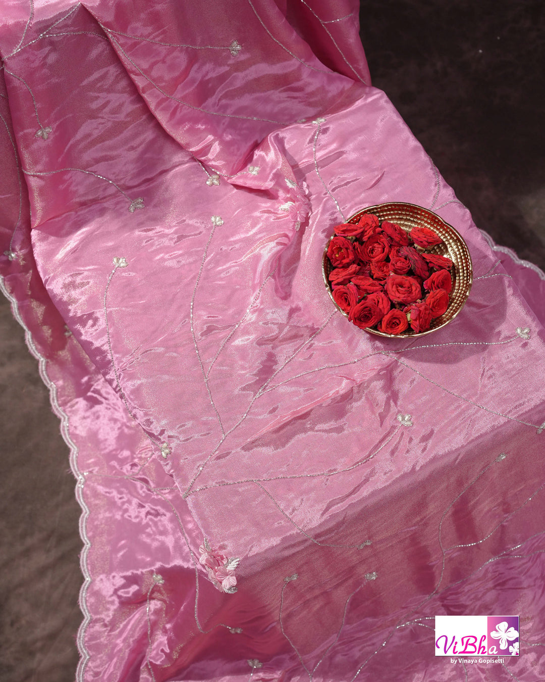 Pink Shimmer Designer Saree with Floral Detailing and Fuchsia Blouse Styling