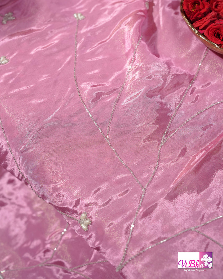 Pink Shimmer Designer Saree with Floral Detailing and Fuchsia Blouse Styling
