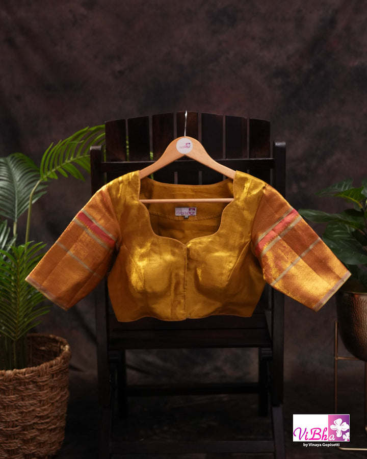Antique Gold Kanchi Silk Saree with Copper Orange Border and Green Accents