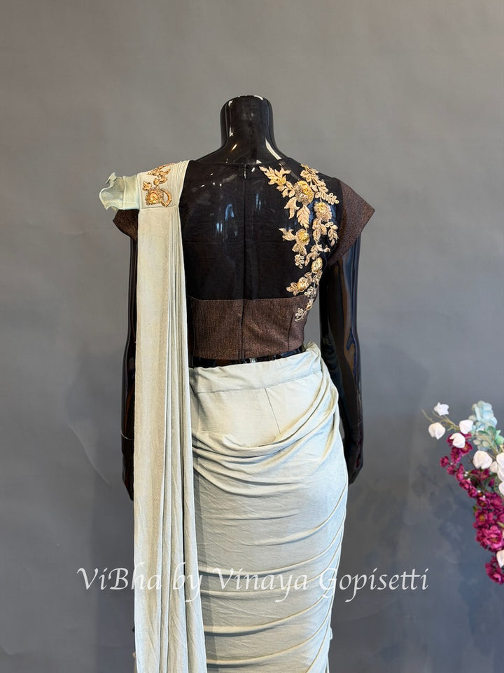 Dusty Ice blue and brown pre draped saree and blouse