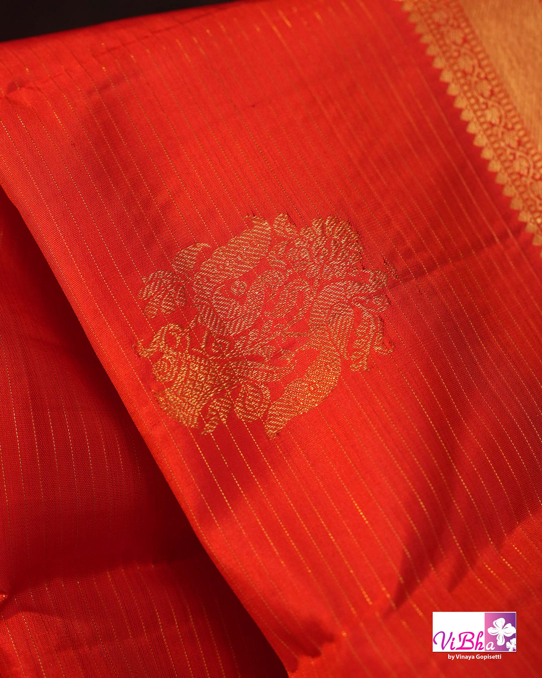 Vermilion Orange Kanchi Silk Saree with Gold Zari Weaving and Green Embroidered Blouse