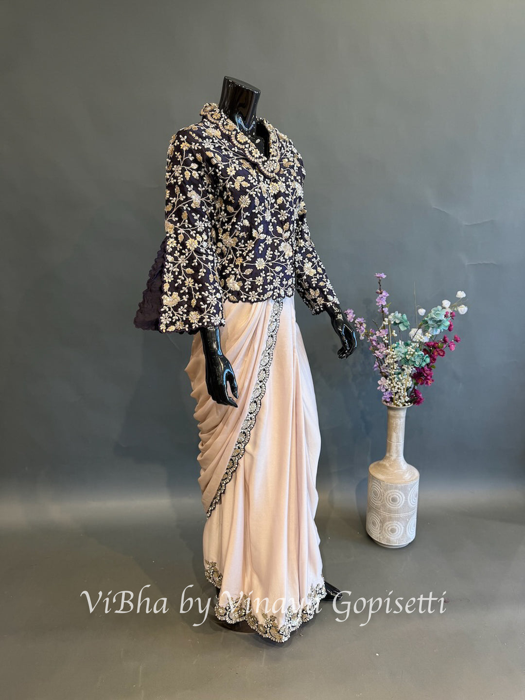 Blush pink and dark purple jacket pre draped saree