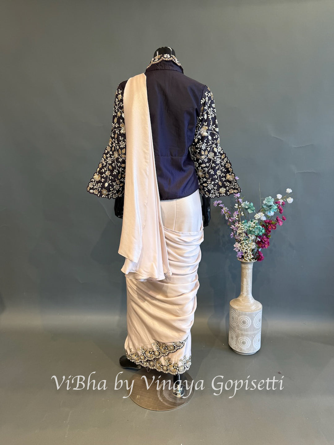 Blush pink and dark purple jacket pre draped saree