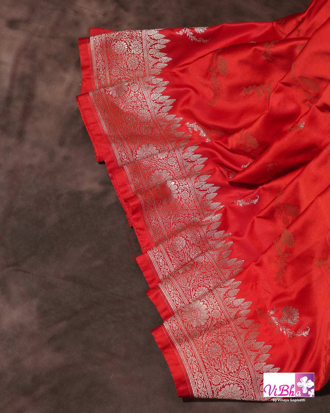 Red all over silver zari saree