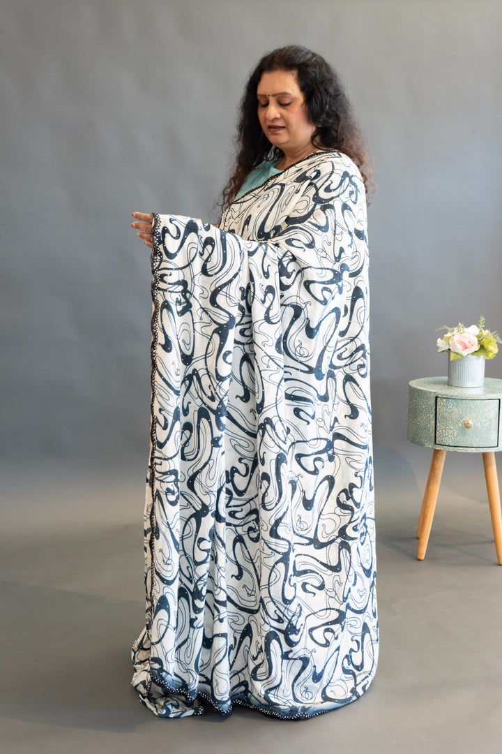 White And Blue Abstract Print Saree And Blouse With Embroidered Borders