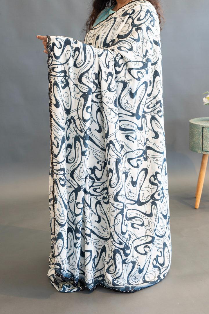 White And Blue Abstract Print Saree And Blouse With Embroidered Borders