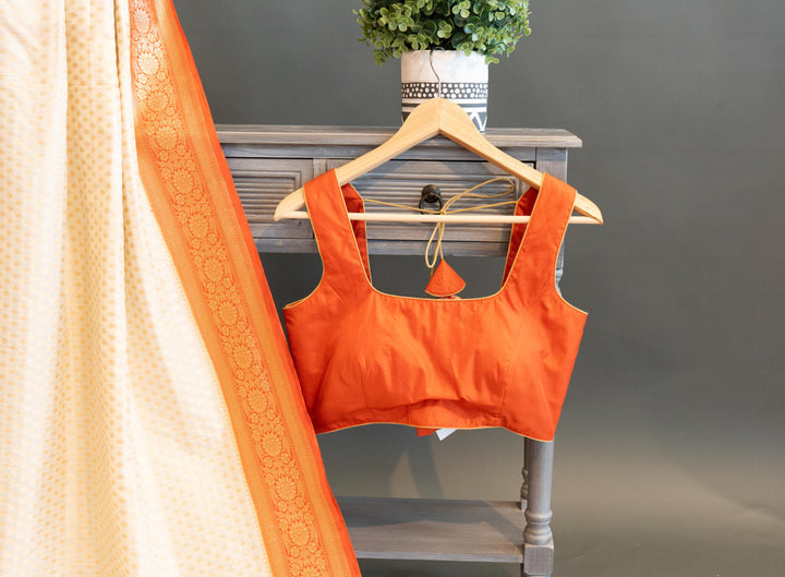 Off-white And Orange Banarasi Silk Saree And Blouse