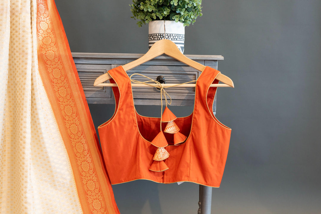 Off-white And Orange Banarasi Silk Saree And Blouse