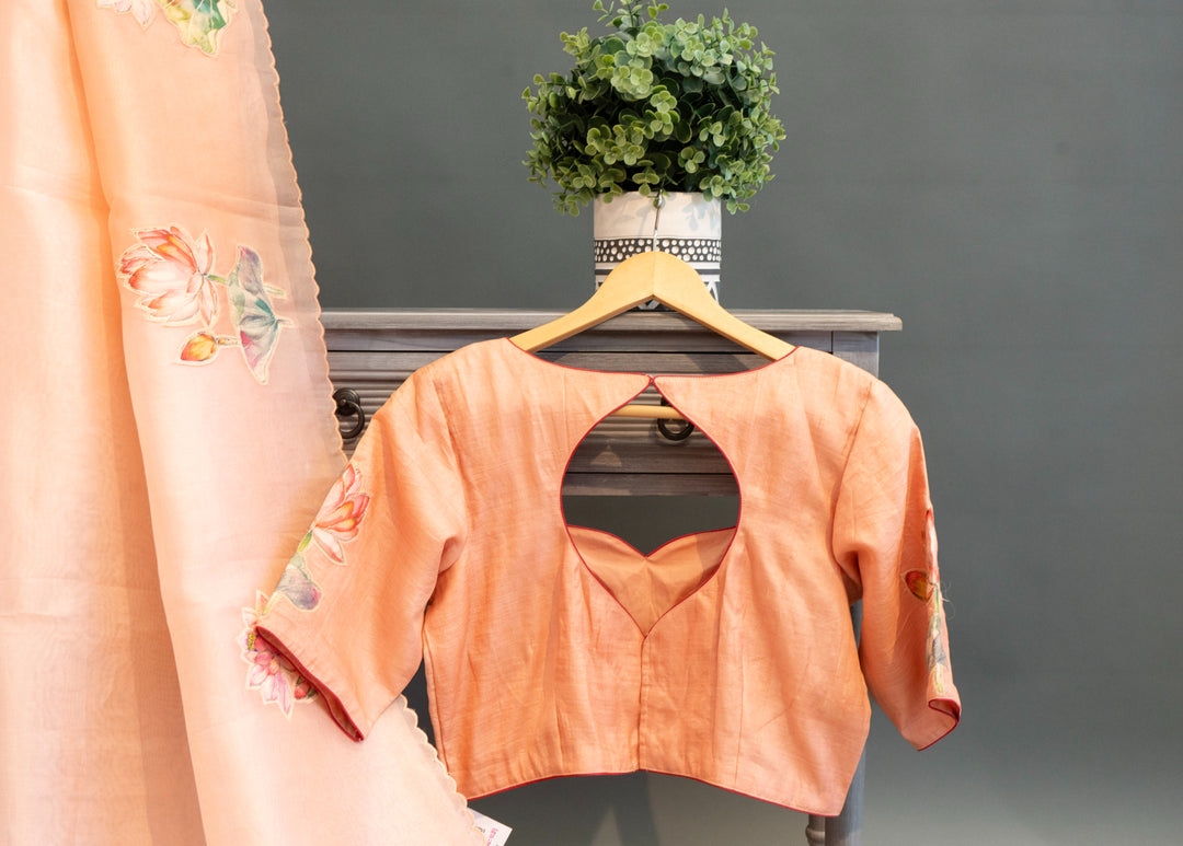 Pastel-Peach Soft Organza Saree And Blouse With Pichwai Work