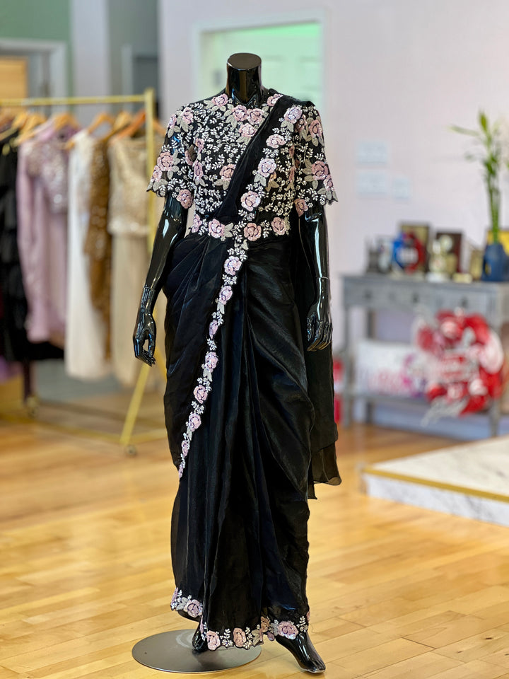 Model wearing black glass silk ready saree