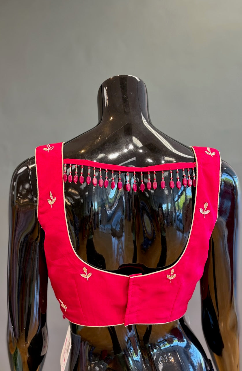 Rani Pink Embroidered Saree And Blouse