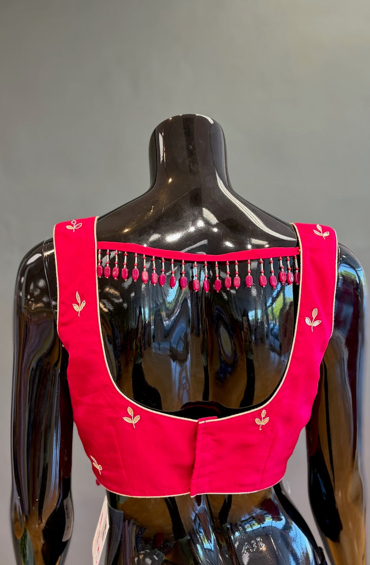 Rani Pink Embroidered Saree And Blouse
