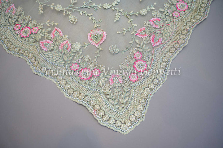 Pastel green embroidered saree
