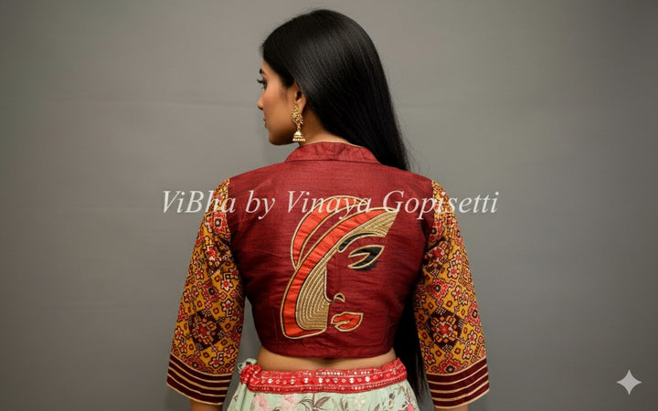 Maroon hand painted blouse with embroidery and patola sleeves