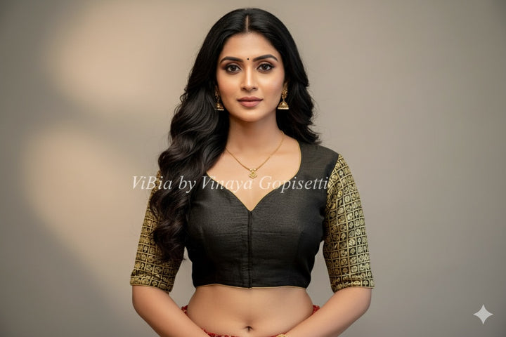 Black hand painted blouse with embroidery and Benares brocade sleeves.