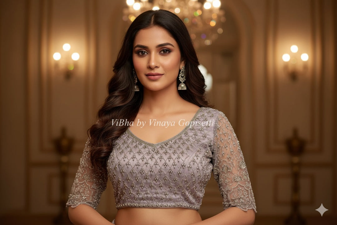 Pastel Lavender Net Blouse With Silver Zari And Crystal Embroidery.