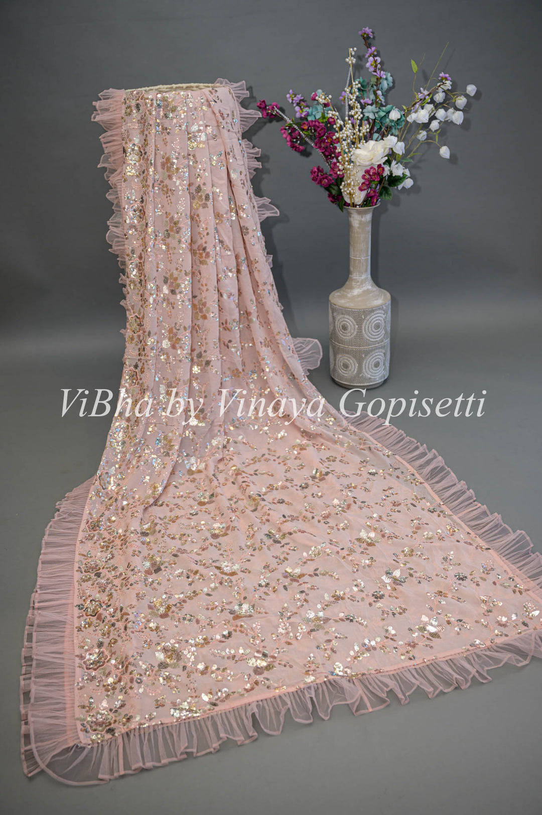 Pastel Peach Georgette Sequins Ruffle Border Saree And Blouse