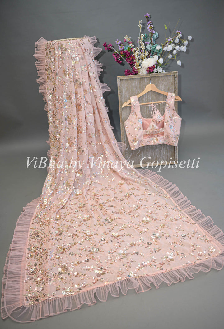 Pastel Peach Georgette Sequins Ruffle Border Saree And Blouse