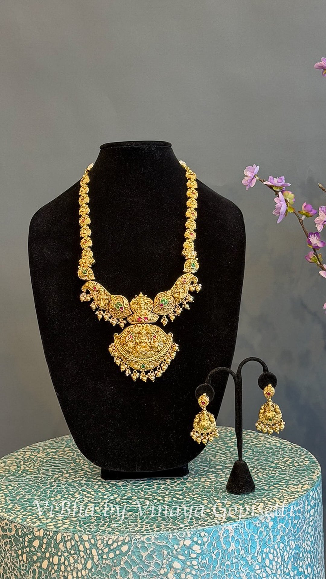 Gold Finish Lakshmi Temple Necklace Set with Red and Green Stones