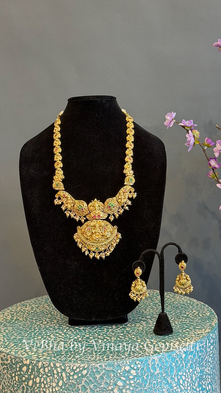 Gold Finish Lakshmi Temple Necklace Set with Red and Green Stones