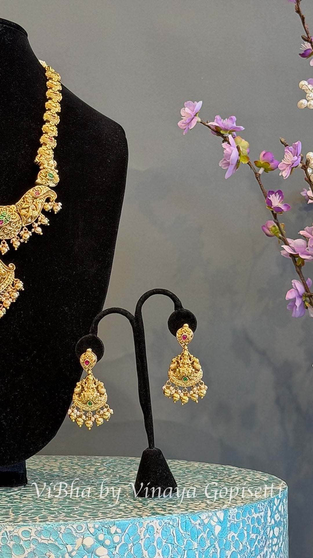 Gold Finish Lakshmi Temple Necklace Set with Red and Green Stones