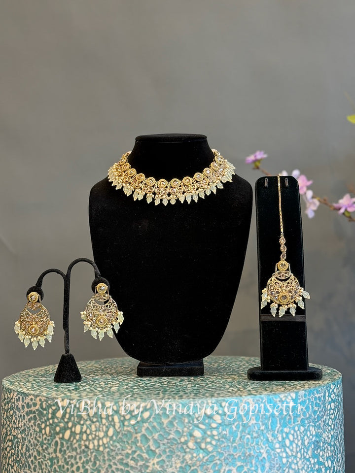 Gold Finish Clear Stone and Pale Yellow Bead Choker Set with Maang Tikka
